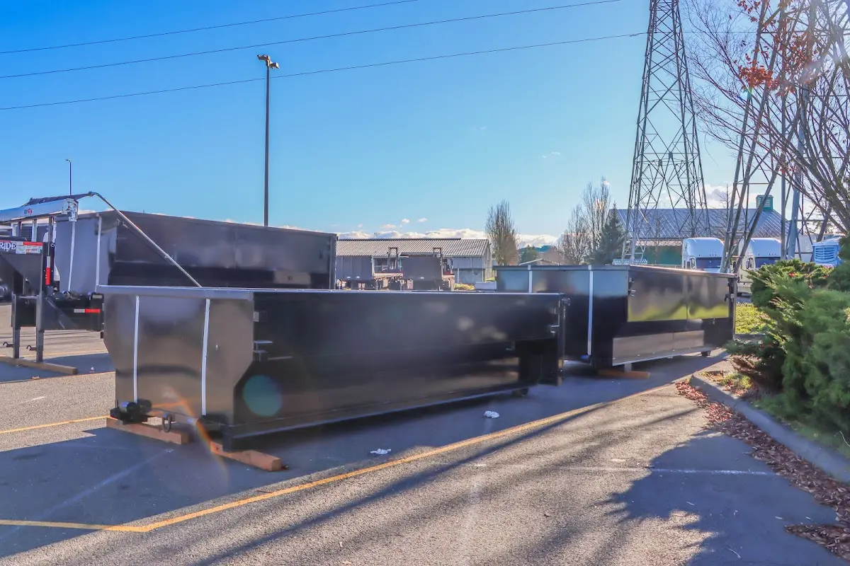 Roll-off dumpster ready for waste disposal at job site for 2 Yard Dumpster Rental in Gloucester